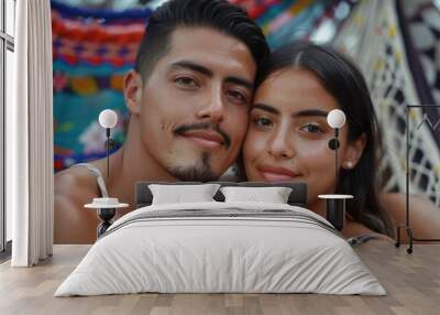 A man and a woman standing together, smiling, and posing for a picture Wall mural