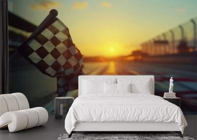 A person holding a checkered flag on a racing track, great for motorsport and sports events Wall mural