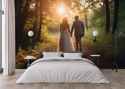 A picture of a bride and groom walking down a path in the woods. This image can be used for wedding themes and outdoor adventures. Wall mural