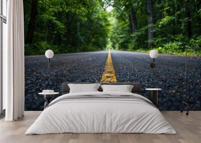 A road with a yellow line in the middle. Perfect for transportation concepts Wall mural