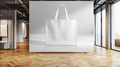 A white tote bag sits on a table with a simple, clean background Wall mural