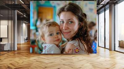 a woman holding a baby in a classroom. suitable for education and parenting concepts Wall mural