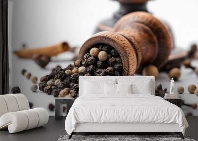 A wooden pepper mill full of black pepper, suitable for kitchen use Wall mural