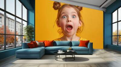 A young girl with her mouth open and hair styled in pigtails. Suitable for various projects and designs Wall mural