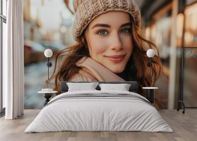 A young woman wearing a hat and scarf, looking stylish and casual Wall mural