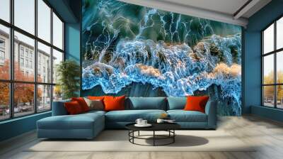 Aerial view of ocean waves crashing on sandy beach Wall mural