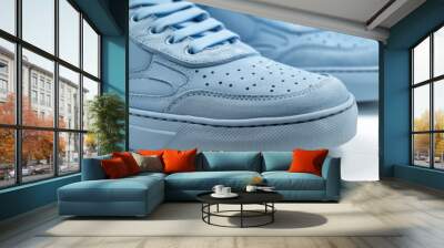 Pair of blue sneakers on a white background. Suitable for sports and fashion concepts Wall mural