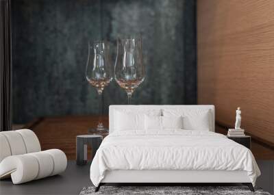 glass of white wine on wooden table Wall mural