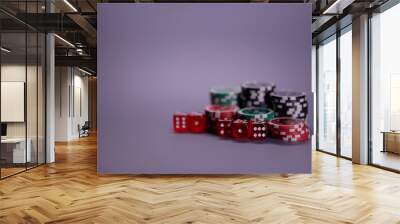 Casino games and gambling concept with stacked poker chips and red dice used in the game of craps. Copy space. Wall mural