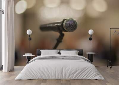 Microphone over the Abstract blurred photo of conference hall or seminar room background Wall mural