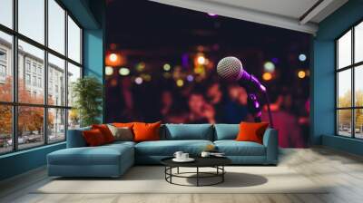 Microphone with blurred colorful bright light in dark night background, soft focus image for business technology communication concepts. Wall mural