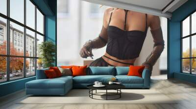 Showing body. Beautiful woman in underwear is posing indoors. Wall mural