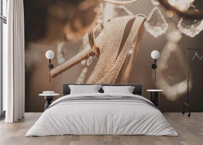 white wedding shoes hanging on the chandelier. Wall mural