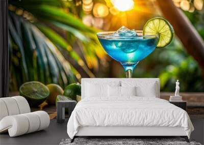 A glass of blue liquid with a lime garnish sits on a wooden table Wall mural