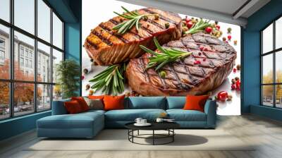 Two pieces of meat with rosemary and pepper on top Wall mural