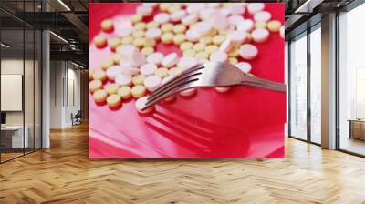 tablets on a plate with a fork Wall mural