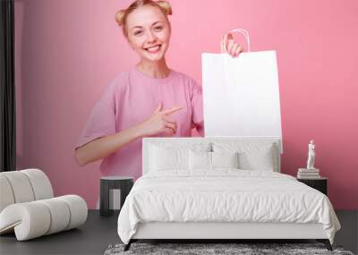 Model shows white paper bag and smiles Wall mural