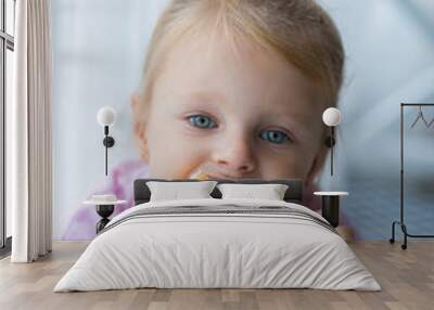 baby girl eating donut pink Wall mural