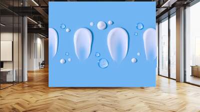 cosmetic smears cream texture on pastel blue background Wall mural