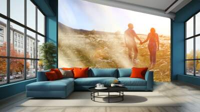 couple man and woman relationship in nature in the setting sun Wall mural