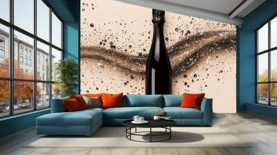 Bottle of champagne with golden glitter or powder splash isolated on beige background Wall mural