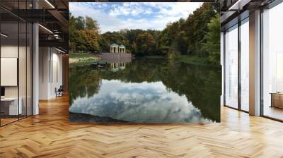 View from the bridge to the autumn Park and two rotunda on the other side under the blue and white clouds sky. Wall mural