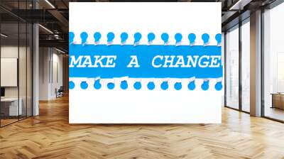 On a blue background with text MAKE A CHANGE two white torn strips of paper. Wall mural