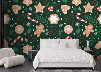 Gingerbread seamless pattern. Festive background with cookies, candies, leaves and berries. Wall mural