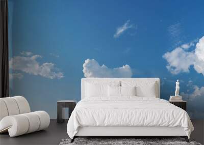 white fluffy clouds standing out against a black background Wall mural