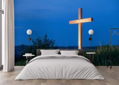 Cross Illuminated by Light in Blue Sky Wall mural