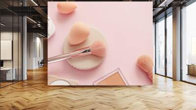 Makeup accessories, brushes and sponges,pink pastel background,flat layot Wall mural