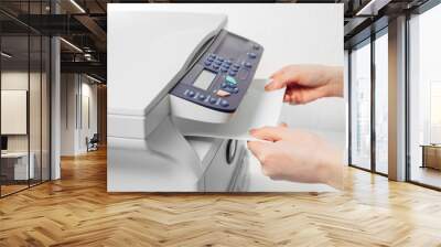 Hand press button on panel of printer. printer scanner laser office copy machine supplies start Wall mural