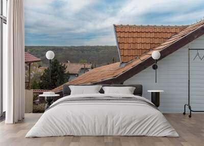 Rooftop of a house in the outer area of a city, photo taken from a drone Wall mural