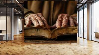 hands hold an open Bible, the sun's rays fall on the Bible. Wall mural