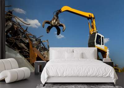 Excavator for loading scrap metal. Wall mural