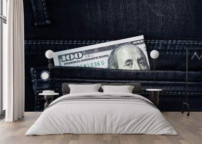 One hundred dollar banknote money in pocket jeans pants background texture. 100 dollar bill close up Wall mural