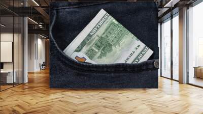 One hundred dollar banknote money in pocket jeans pants background texture. 100 dollar bill close up Wall mural