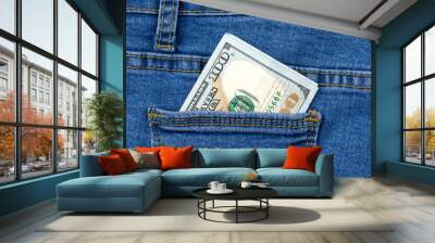 One hundred dollar banknote money in pocket jeans pants background texture. 100 dollar bill close up Wall mural