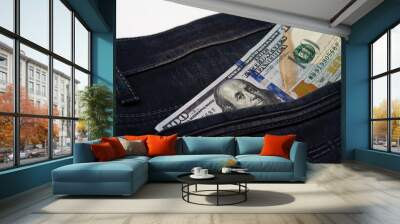 One hundred dollar banknote money in pocket jeans pants background texture. 100 dollar bill close up Wall mural