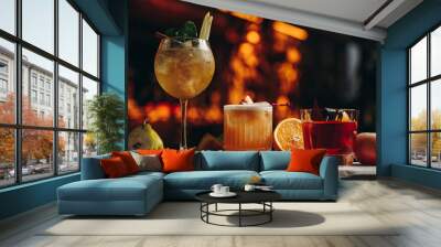 Three different beautiful cocktails in warm colors on a flower background Wall mural