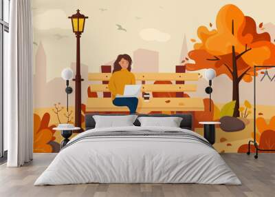 A girl sits on a bench in an autumn park and works at a laptop. Trend colors. Vector illustration in cartoon flat style. Wall mural