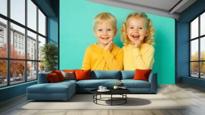 portrait of two happe and smiling children, sister and brother Wall mural