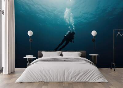 Underwater journey: diver descending, thrill of exploring beneath the surface, surrounded by coral reefs and aquatic life, adventure and tranquility of the diving experience Wall mural