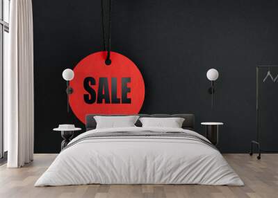 one round red label with the inscription SALE on a dark background, Black Friday Wall mural