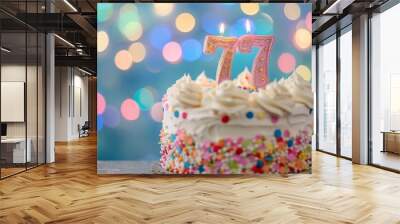 Sweet Birthday cake with number 77 on top on colorful bokeh background, 77th years old happy birthday Cake, copy space Wall mural