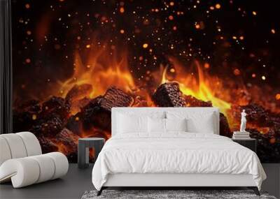 Fire burning in the black background with sparkles Wall mural