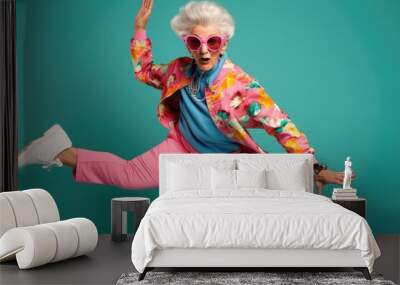 funny old lady doing gymnastics or dancing on colored background Wall mural