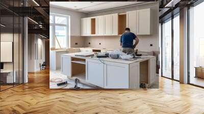 kitchen installation. Worker assembling furniture Wall mural