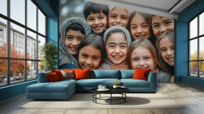 A group of children are smiling and hugging each other Wall mural