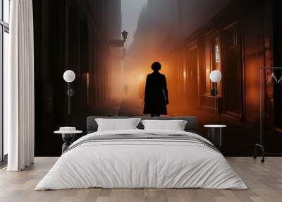 A man is walking down a street at night Wall mural